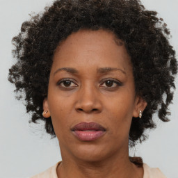 Neutral black adult female with short  brown hair and brown eyes