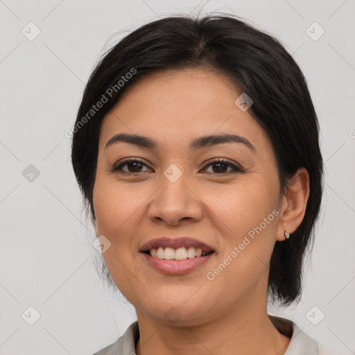 Joyful latino young-adult female with medium  brown hair and brown eyes