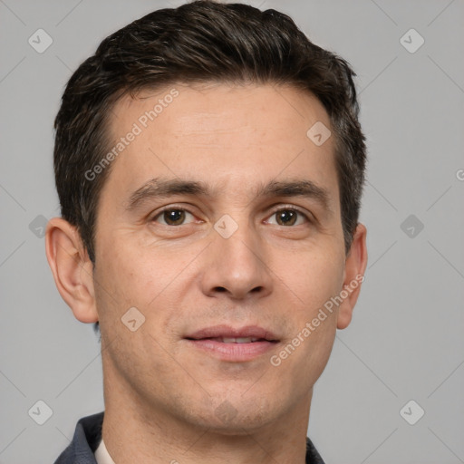 Joyful white adult male with short  brown hair and brown eyes