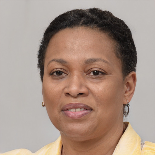 Joyful latino adult female with short  brown hair and brown eyes