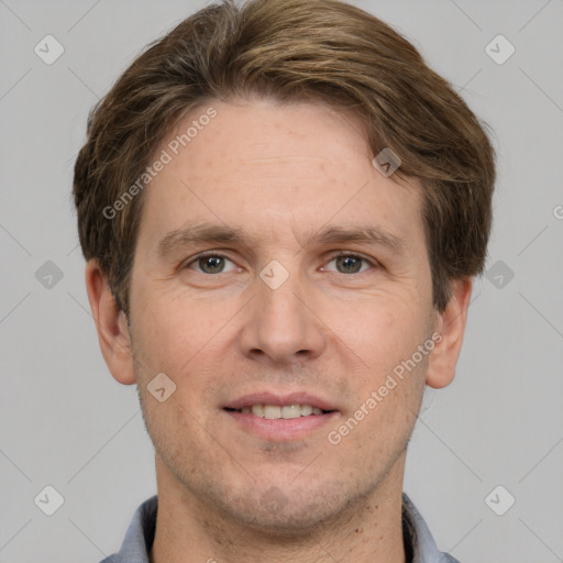 Joyful white adult male with short  brown hair and grey eyes