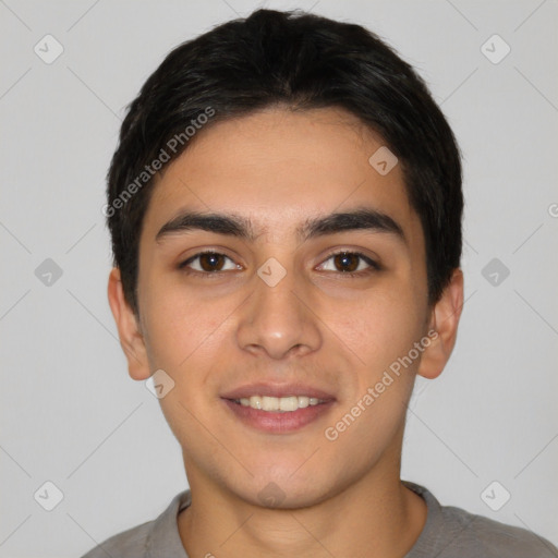 Joyful white young-adult male with short  black hair and brown eyes