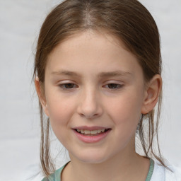 Joyful white child female with medium  brown hair and brown eyes