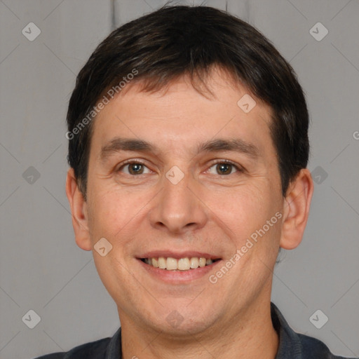 Joyful white adult male with short  brown hair and brown eyes