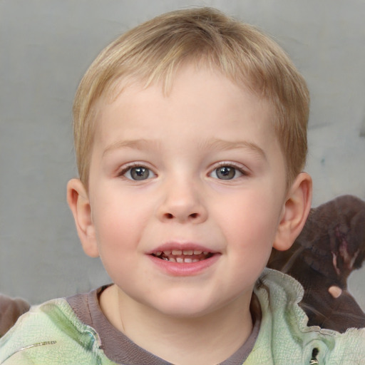 Joyful white child male with short  brown hair and grey eyes