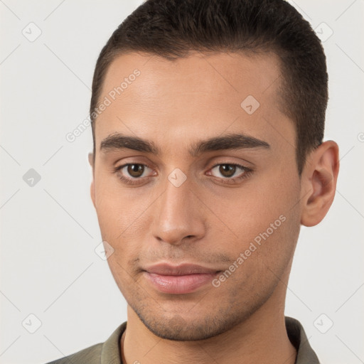 Joyful white young-adult male with short  brown hair and brown eyes