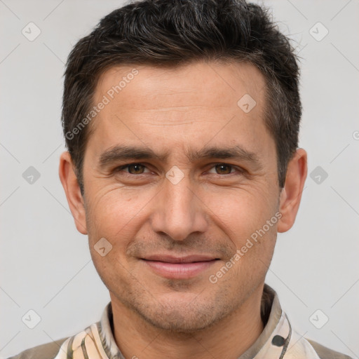 Joyful white adult male with short  brown hair and brown eyes