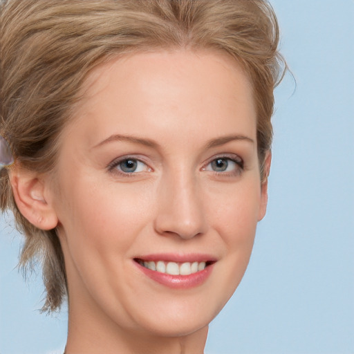 Joyful white young-adult female with medium  brown hair and blue eyes