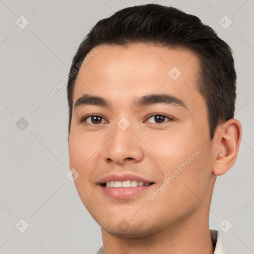 Joyful white young-adult male with short  black hair and brown eyes