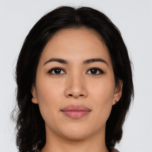Joyful asian young-adult female with long  brown hair and brown eyes