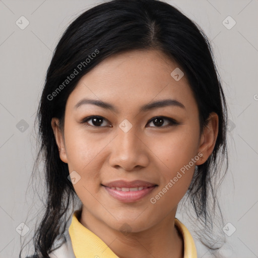 Joyful asian young-adult female with medium  black hair and brown eyes