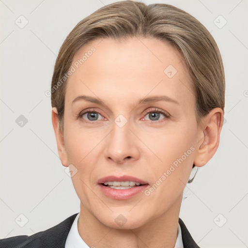 Joyful white adult female with short  brown hair and grey eyes