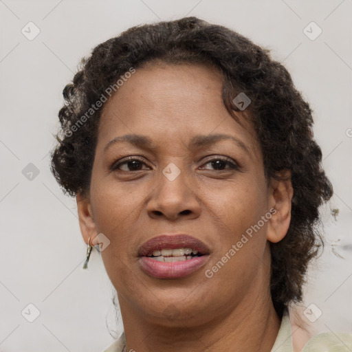 Joyful black adult female with short  brown hair and brown eyes