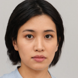 Neutral asian young-adult female with medium  black hair and brown eyes