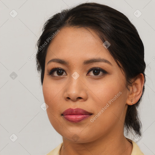 Joyful asian young-adult female with medium  brown hair and brown eyes