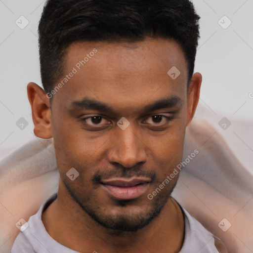 Joyful black young-adult male with short  brown hair and brown eyes