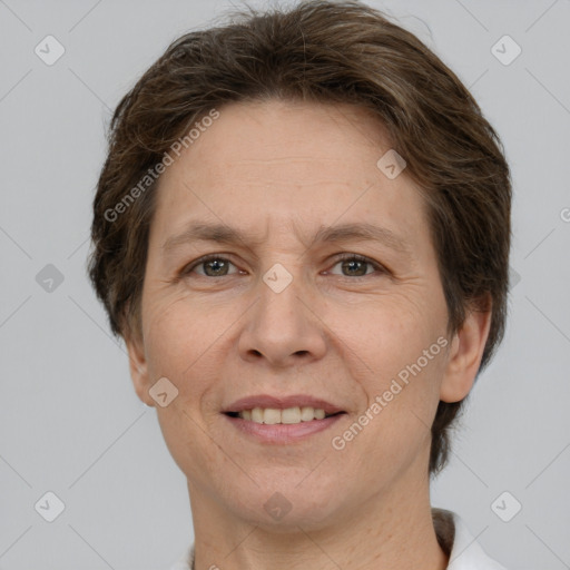 Joyful white adult female with short  brown hair and grey eyes