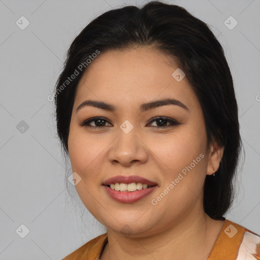 Joyful latino young-adult female with medium  brown hair and brown eyes