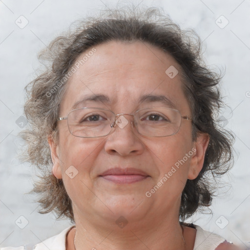 Joyful white middle-aged female with medium  brown hair and brown eyes