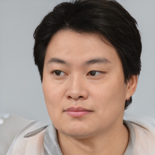 Neutral asian young-adult male with short  brown hair and brown eyes