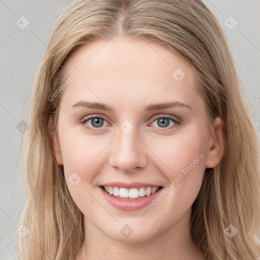 Joyful white young-adult female with long  brown hair and blue eyes