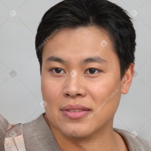 Joyful asian young-adult male with short  brown hair and brown eyes