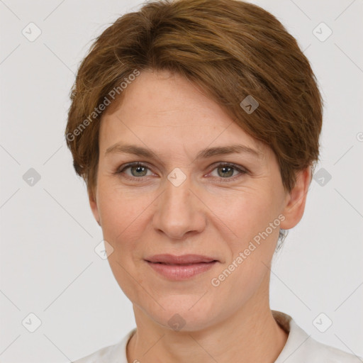 Joyful white adult female with short  brown hair and grey eyes