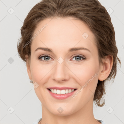 Joyful white young-adult female with medium  brown hair and green eyes