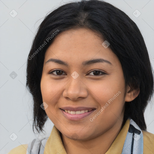 Joyful latino young-adult female with medium  brown hair and brown eyes