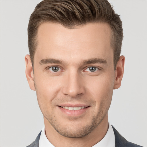 Joyful white young-adult male with short  brown hair and brown eyes