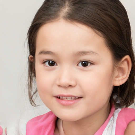 Joyful white child female with medium  brown hair and brown eyes