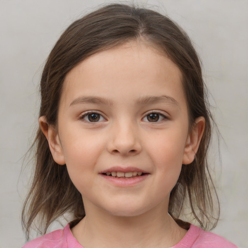 Joyful white child female with medium  brown hair and brown eyes