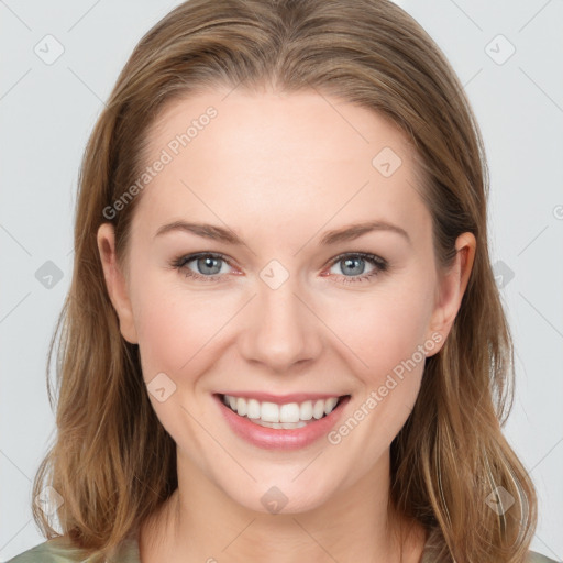 Joyful white young-adult female with medium  brown hair and blue eyes