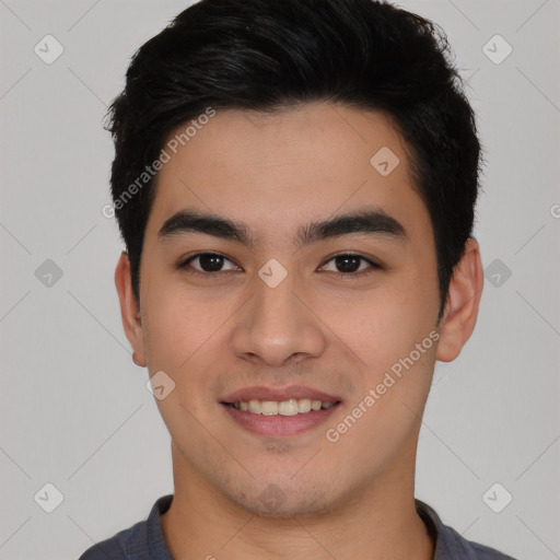 Joyful asian young-adult male with short  black hair and brown eyes