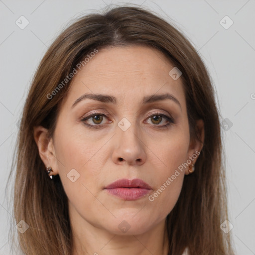 Joyful white adult female with long  brown hair and brown eyes