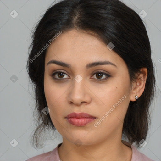 Joyful latino young-adult female with medium  brown hair and brown eyes