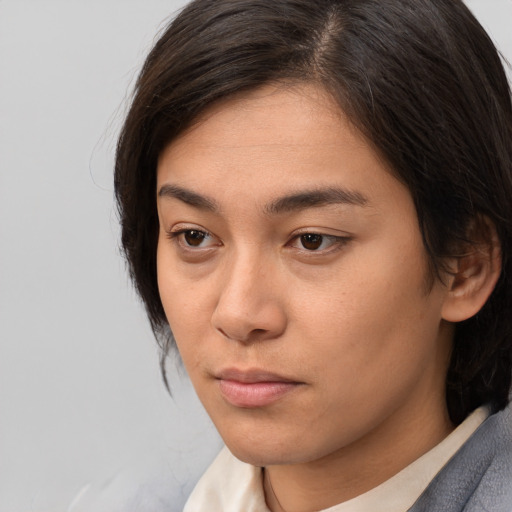 Neutral white young-adult female with medium  brown hair and brown eyes