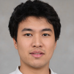 Neutral asian young-adult male with short  brown hair and brown eyes