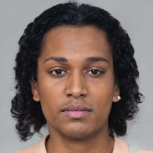 Neutral black young-adult female with long  black hair and brown eyes