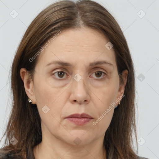 Joyful white adult female with long  brown hair and brown eyes