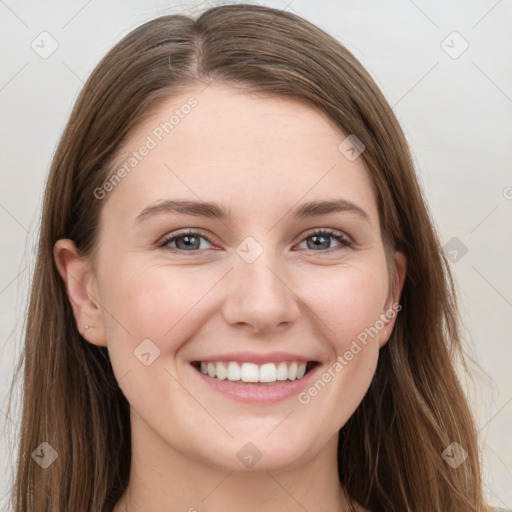 Joyful white young-adult female with long  brown hair and grey eyes