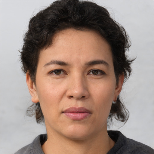 Neutral white young-adult female with short  brown hair and brown eyes