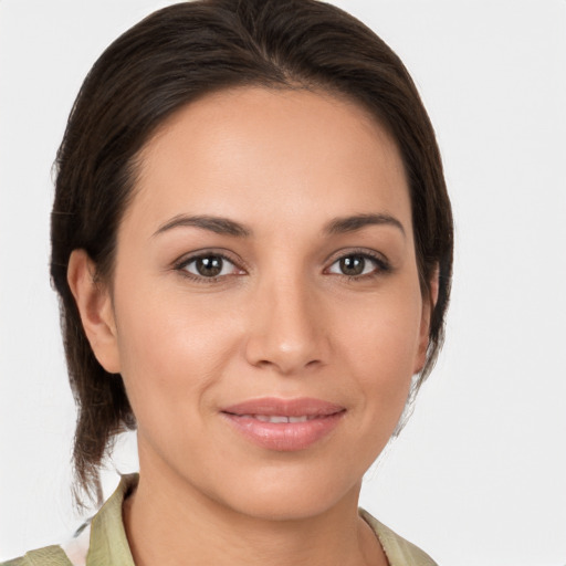 Joyful white young-adult female with medium  brown hair and brown eyes