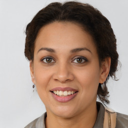 Joyful latino young-adult female with medium  brown hair and brown eyes