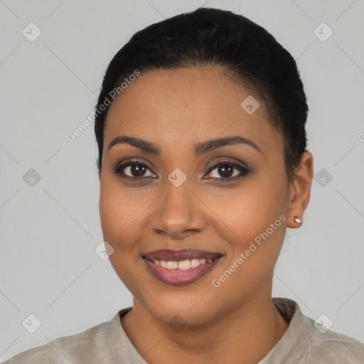 Joyful latino young-adult female with short  black hair and brown eyes