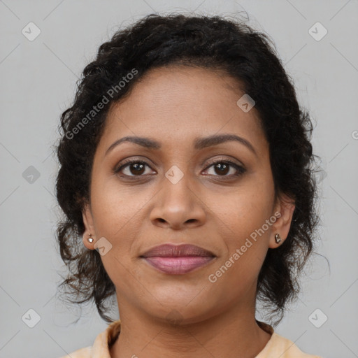 Joyful black young-adult female with medium  brown hair and brown eyes