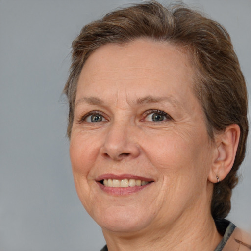 Joyful white middle-aged female with short  brown hair and brown eyes