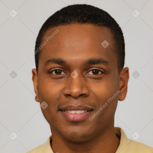 Joyful black young-adult male with short  black hair and brown eyes