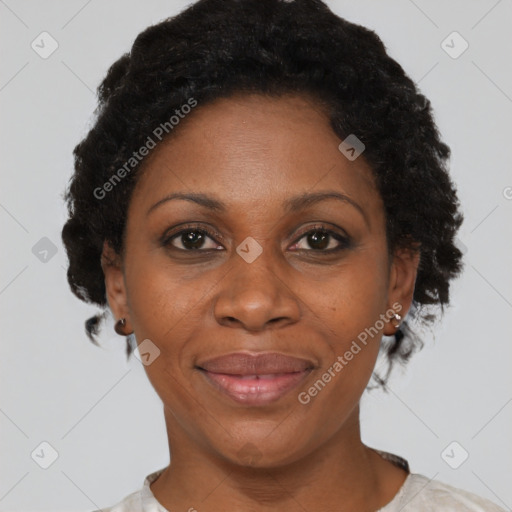 Joyful black adult female with short  brown hair and brown eyes