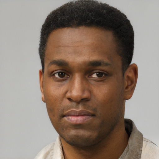 Neutral black young-adult male with short  black hair and brown eyes